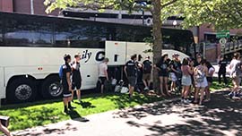 Our Motorcoach awaits our sightseeing group