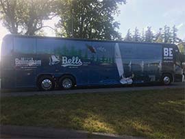 Our Motorcoach awaits our sightseeing group