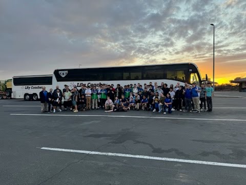 Our Motorcoach awaits our sightseeing group