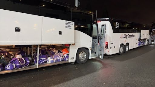 Our Motorcoach awaits our sightseeing group